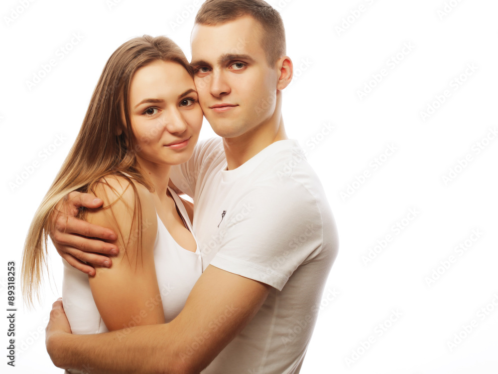 lovely happy couple hugging over white background. lovely happy couple hugging over white background.