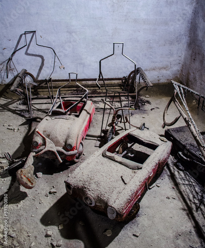 Old toys in Naples underground, Italy. This medieval place was used during WW2 as a shelter during air raids. photo