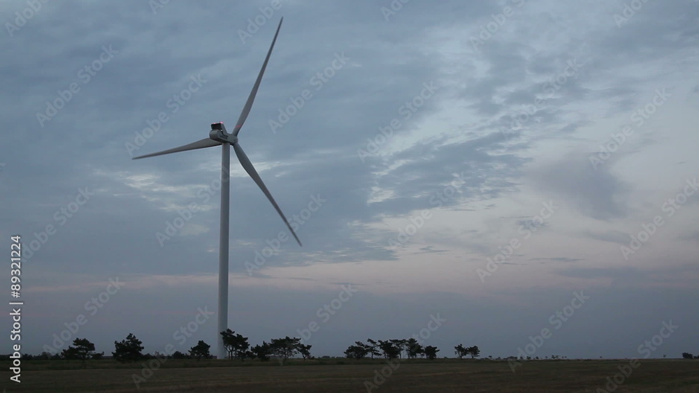 Wind turbines with power line in the sunset Wind turbines with power line in the sunset