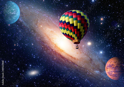 Hot air balloon surreal wonderland fairy tale landscape fantasy planets. Elements of this image furnished by NASA.