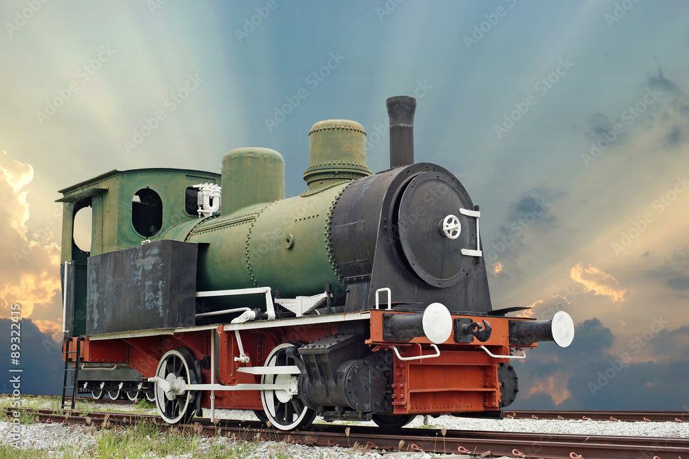 Fototapeta premium old steam engine locomotive train on beautiful sky background