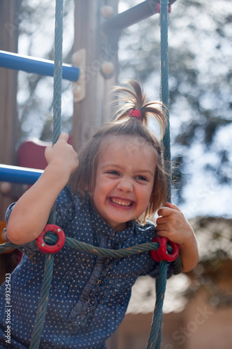 Tablou pe pânză girl developing dexterity at playground