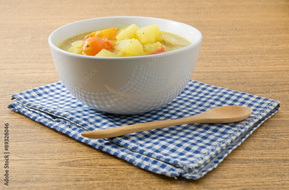 Vegetable Soup with Potato and Tomato in White Bowl Vegetable Soup with Potato and Tomato in White Bowl