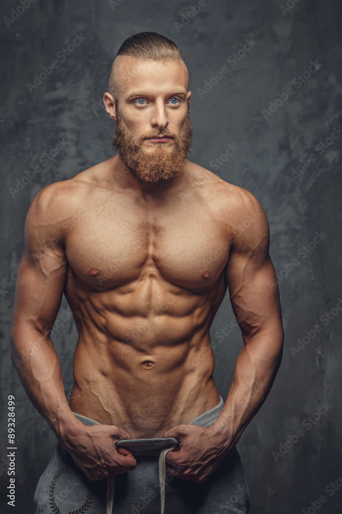 Muscular man with beard showing his great body. Muscular man with beard showing his great body.