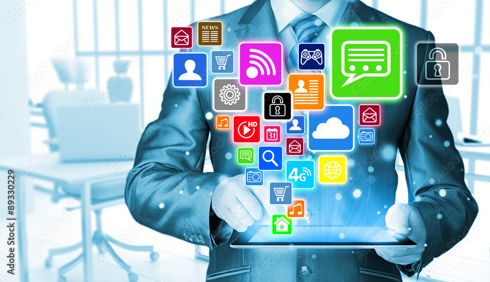 Business man using tablet PC with social media icon set