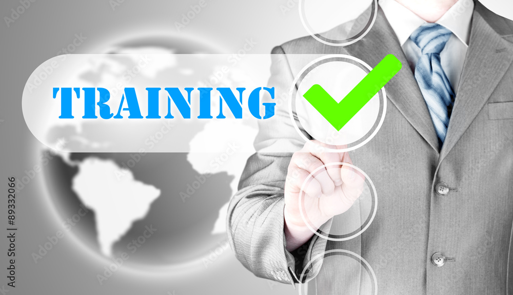 Businessman pressing touch screen interface training checkbox Businessman pressing touch screen interface training checkbox