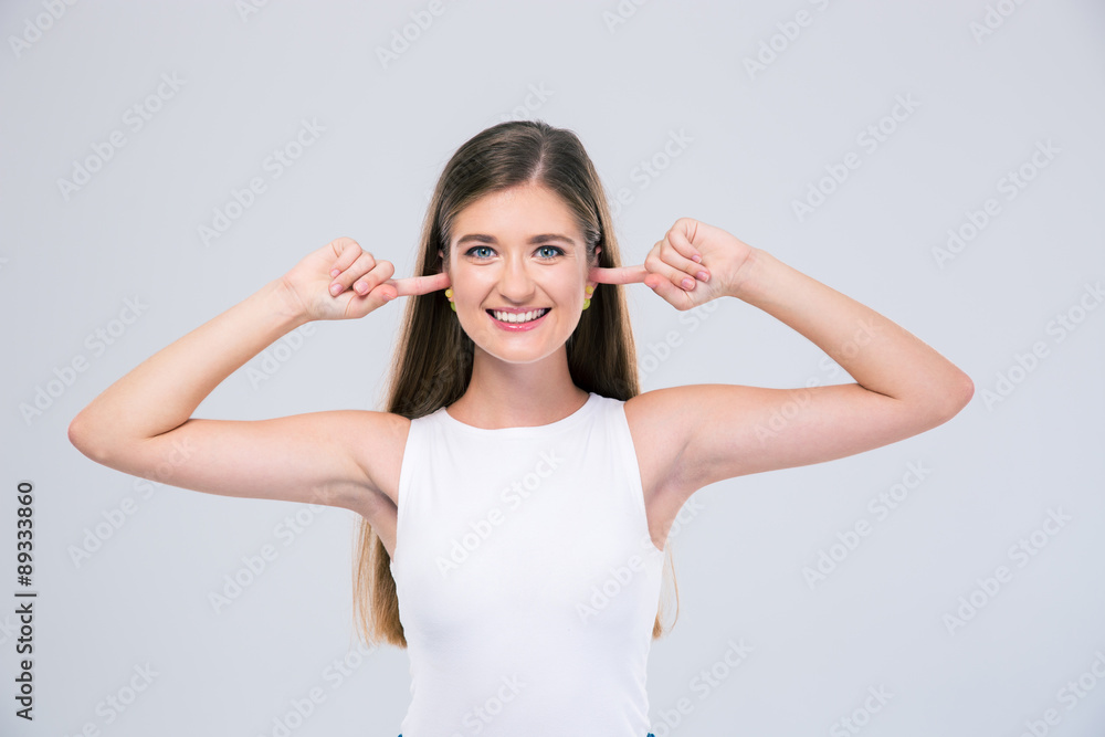 Fototapeta premium Female teenager covering her ears