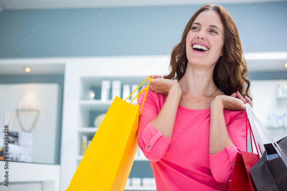 Pretty woman holding shopping bags