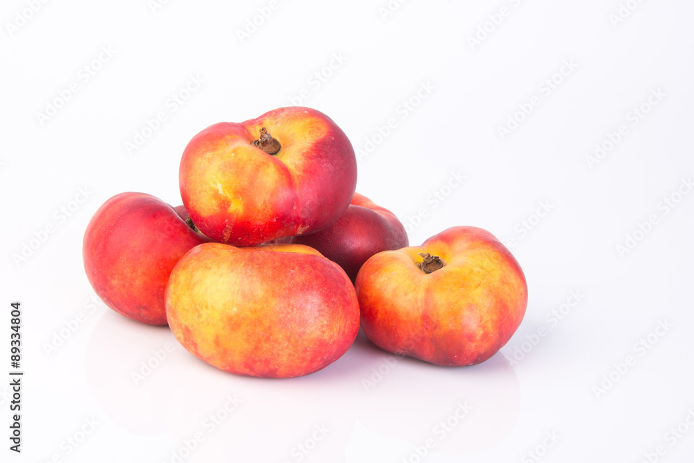 flat peaches (donut peaches) on a background flat peaches (donut peaches) on a background