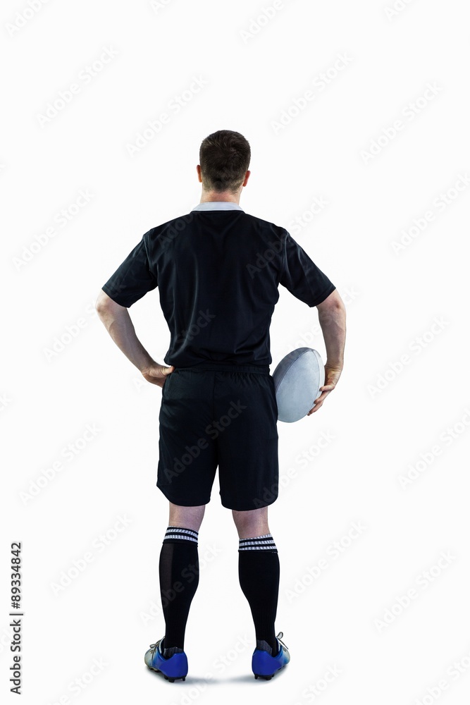 Rugby player holding a rugby ball Rugby player holding a rugby ball