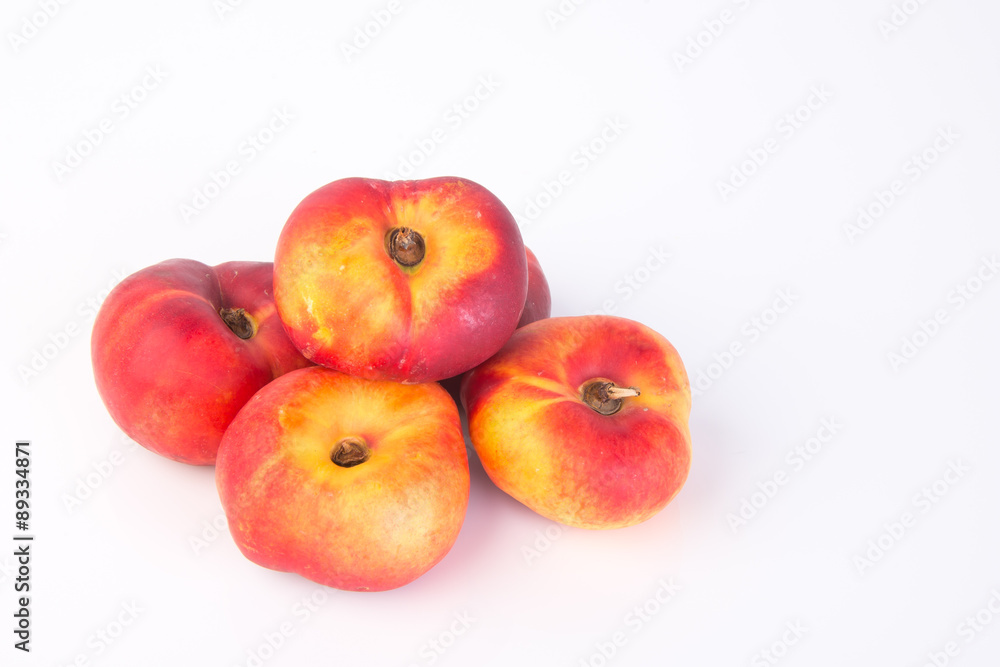 flat peaches (donut peaches) on a background flat peaches (donut peaches) on a background