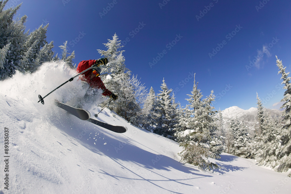 Expert skier on a sunny day in Stowe, VT, USA