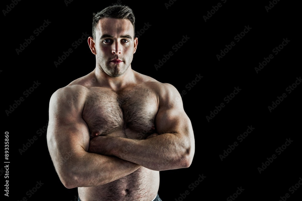 Strong bodybuilder with arms crossed