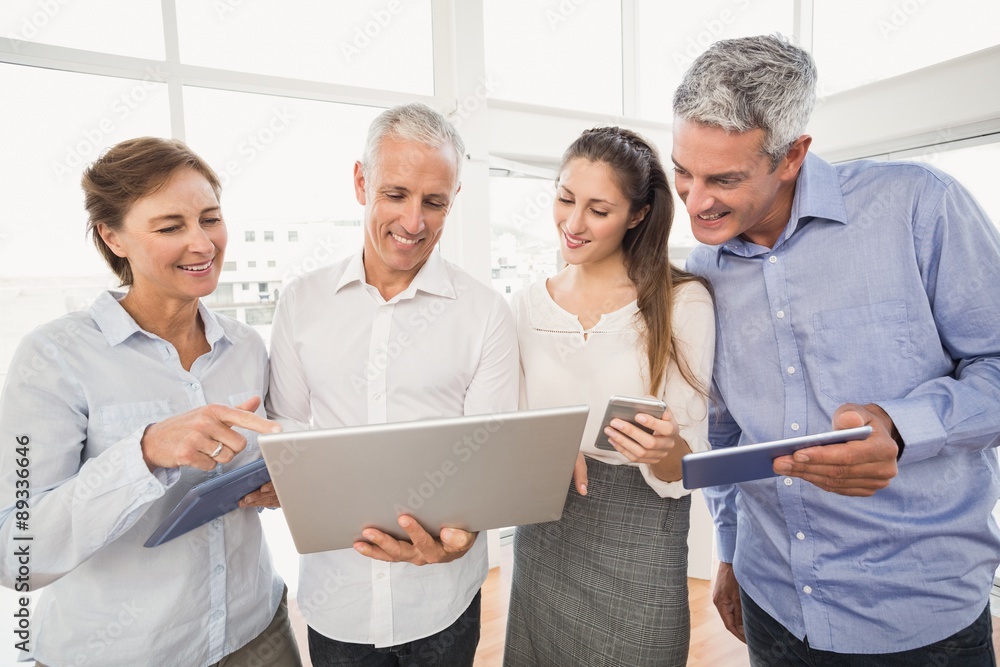 Fototapeta premium Business people using several electronic devices