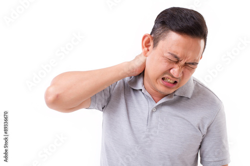 man suffering from neck pain
