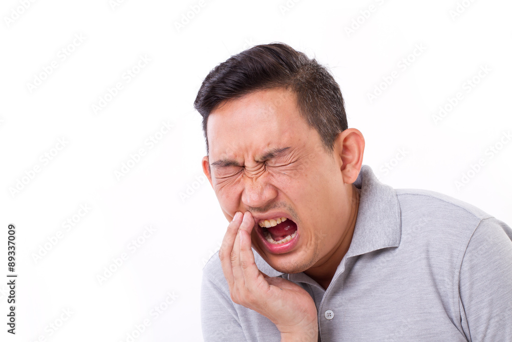 man suffering from toothache, tooth sensitivity
