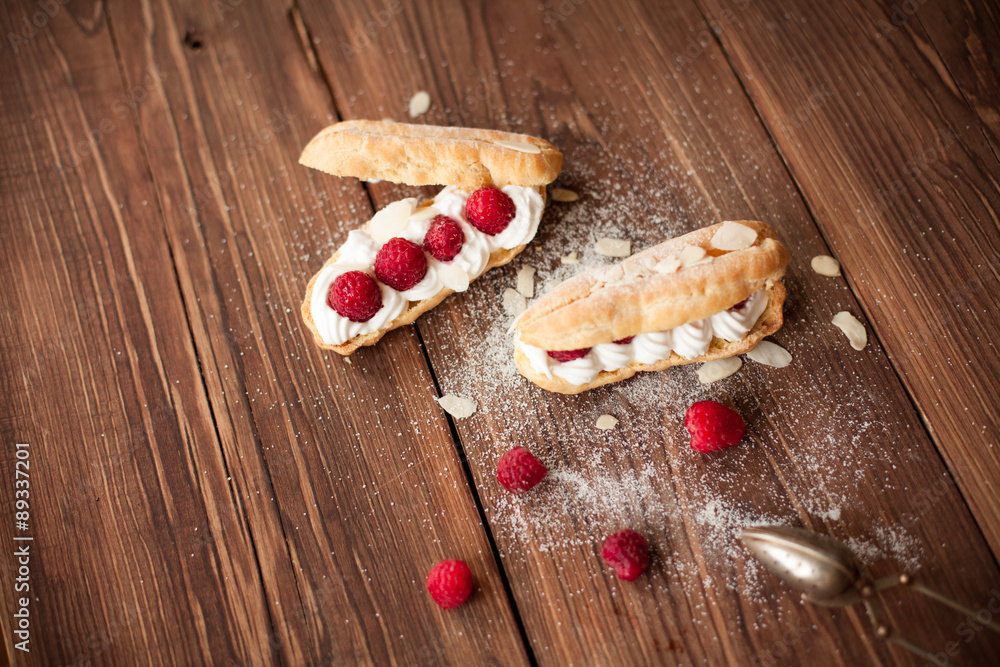 Sweet dessert with fresh raspberries on wood table Sweet dessert with fresh raspberries on wood table