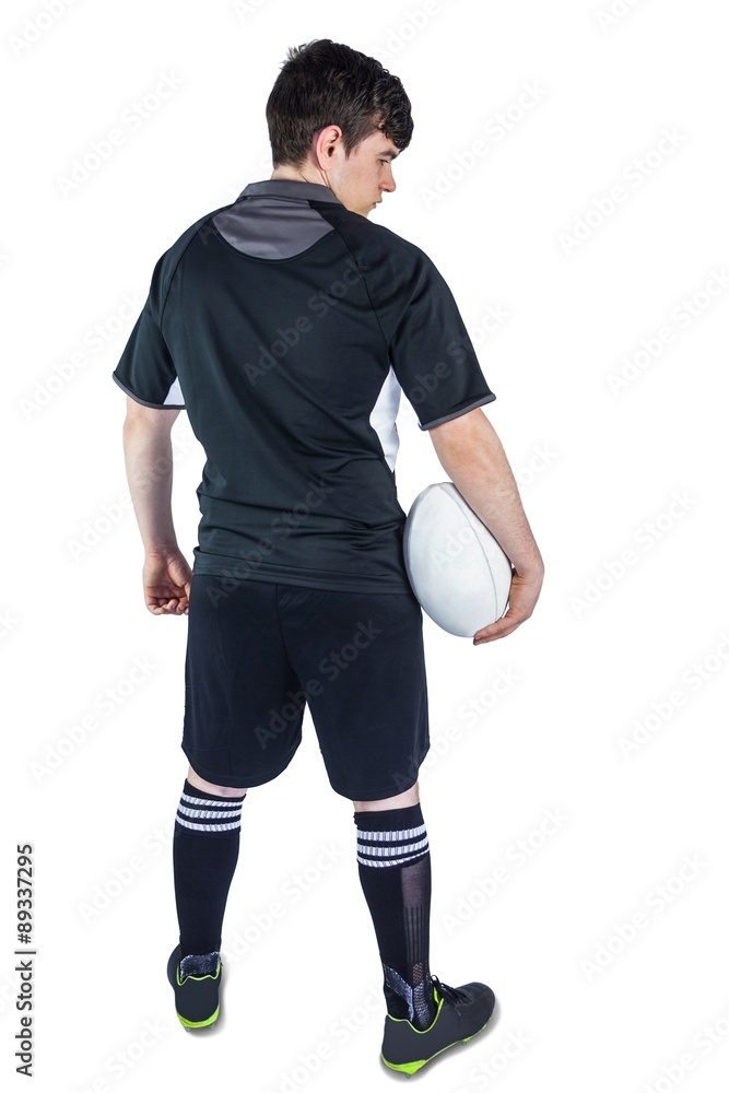 Back turned rugby player holding a ball Back turned rugby player holding a ball