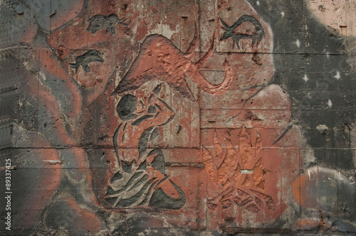 The picture on the wall/Graffiti pattern primitive man and animal in ethnic style