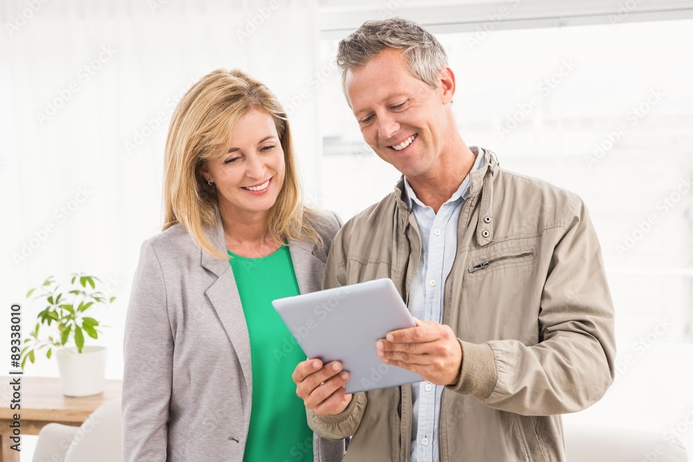 Casual business colleagues working with tablet Casual business colleagues working with tablet