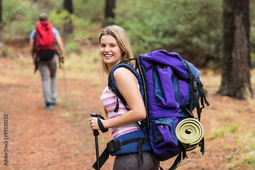 Portrait of a young happy hiker woman