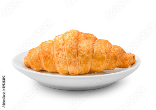 delicious fresh croissant on a white plate isolated on white bac