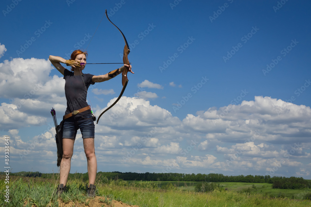 Archery woman bends bow archer target narrow - obrazy, fototapety, plakaty 