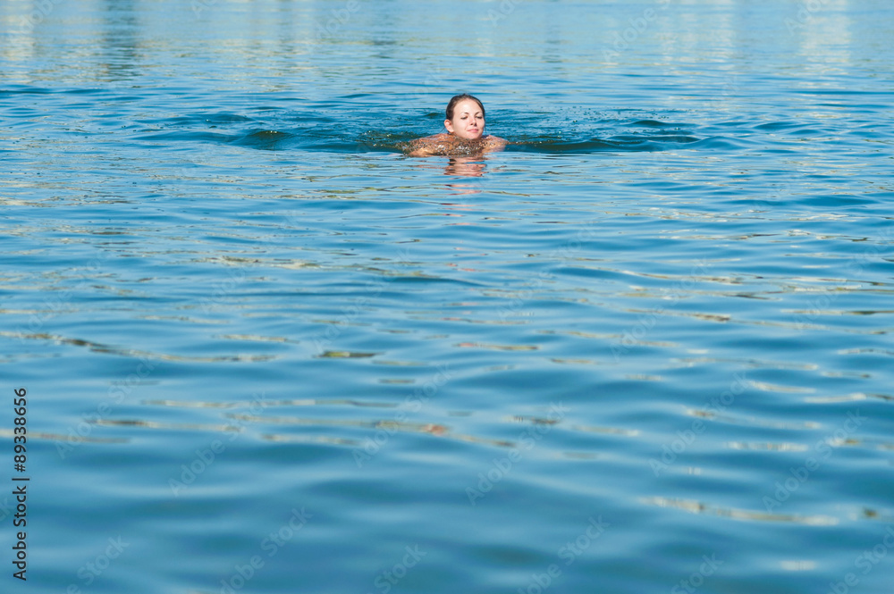 Girl swimming in river
