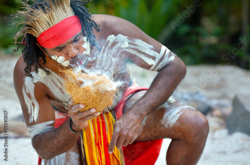 Yugambeh Aboriginal warrior man demonstrate fire making craf photo