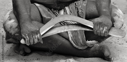 Hands of Yugambeh Aboriginal worrior man  holds boomerangs photo