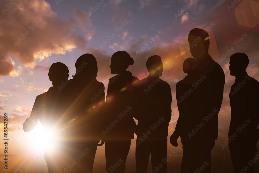 Composite image of silhouetters celebrating Composite image of silhouetters celebrating