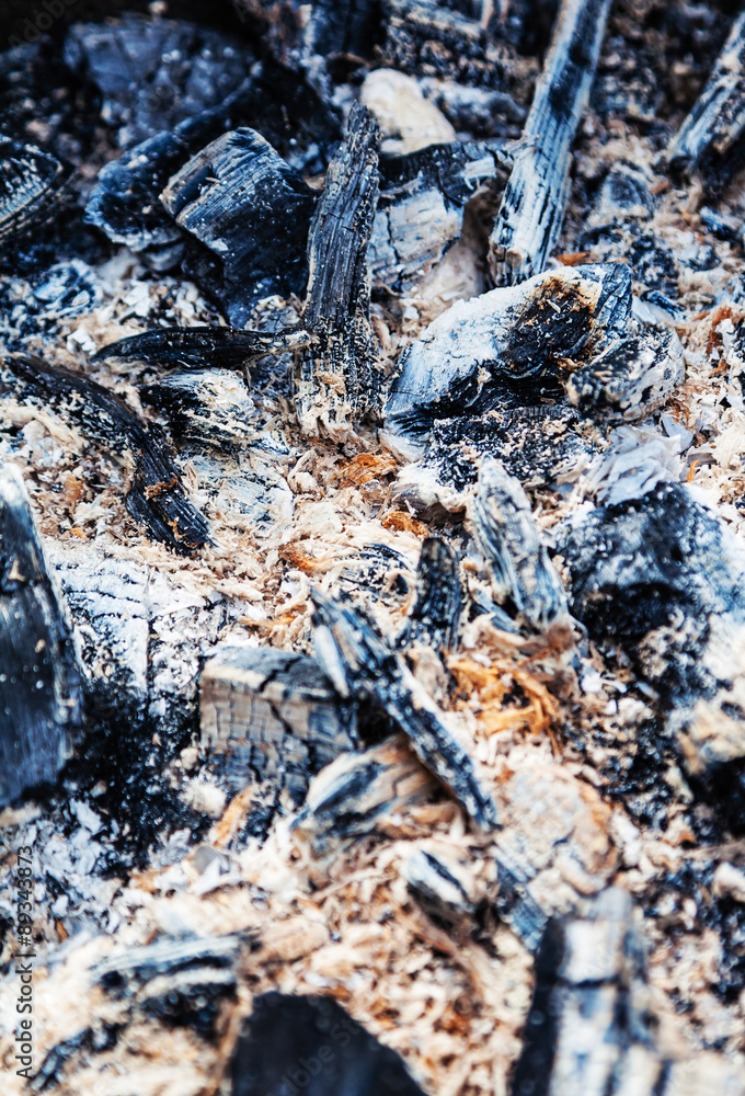 Fototapeta premium Burnt coal and sawdust taken at close range