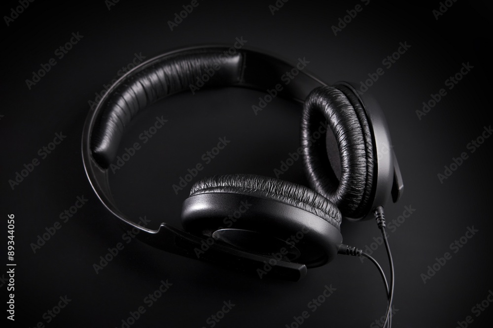 Black Headphones on a black background Black Headphones on a black background