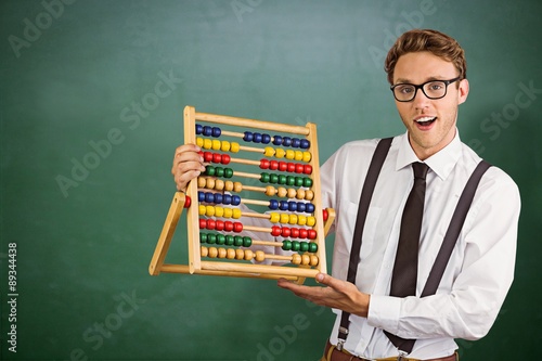 Murais de parede Composite image of geeky businessman using an abacus