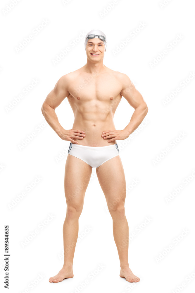 Young handsome swimmer posing in white swim trunks Young handsome swimmer posing in white swim trunks