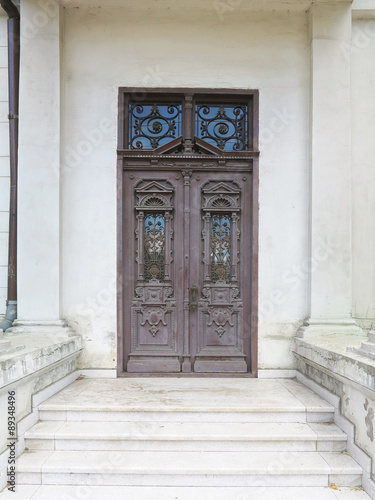 Old brown vintage wooden door with decoration