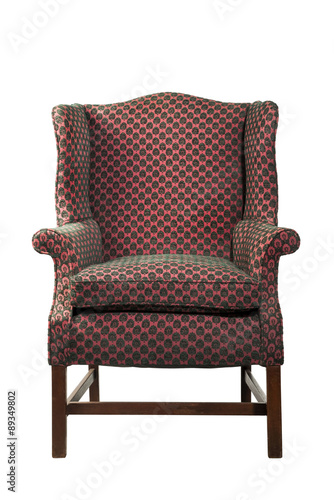 Large wing chair upholstered in red old antique isolated