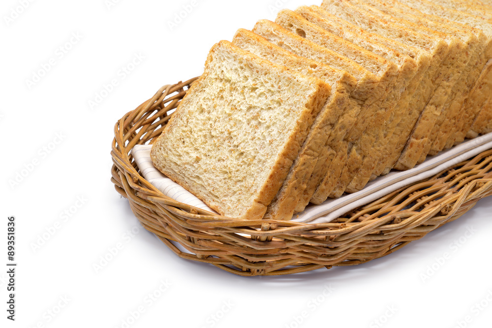 Isolated whole wheat bread in a rattan basket