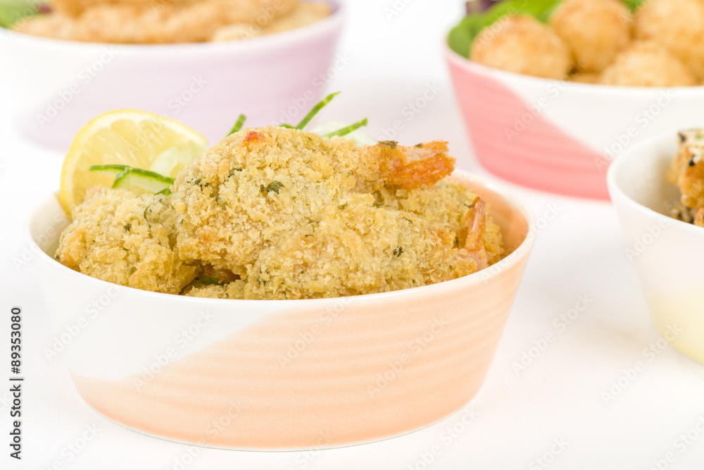 Party Food - Selection of prawn dishes on a wooden background. Prawn Toast, Prawn Popcorn, Butterfly Prawn and Prawn Goujons.
Party Food - Selection of prawn dishes on a wooden background. Prawn Toast, Prawn Popcorn, Butterfly Prawn and Prawn Goujons.