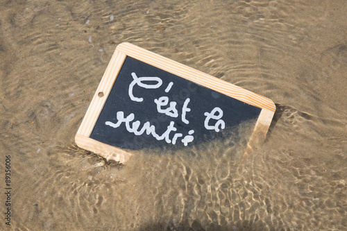 C'est la rentree (meaning Back to school) written on black chalkboard