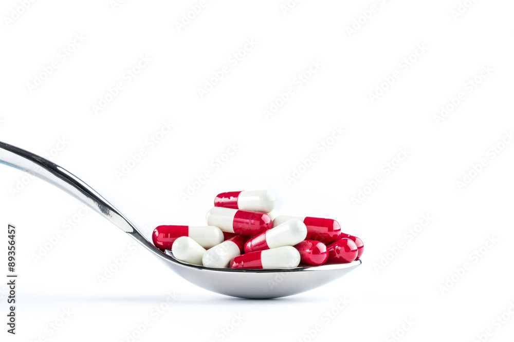 Capsules in silver spoon, Healthcare and Medicine Capsules in silver spoon, Healthcare and Medicine