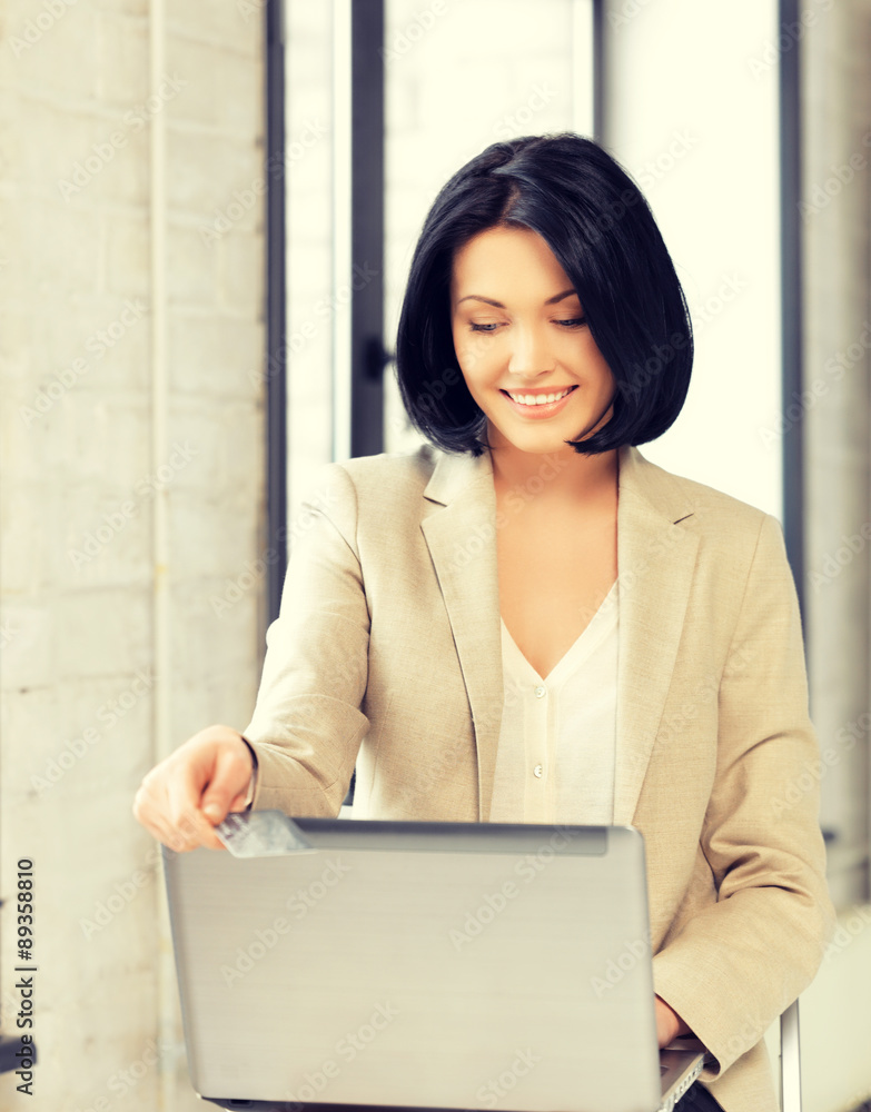 happy woman with laptop computer and credit card happy woman with laptop computer and credit card