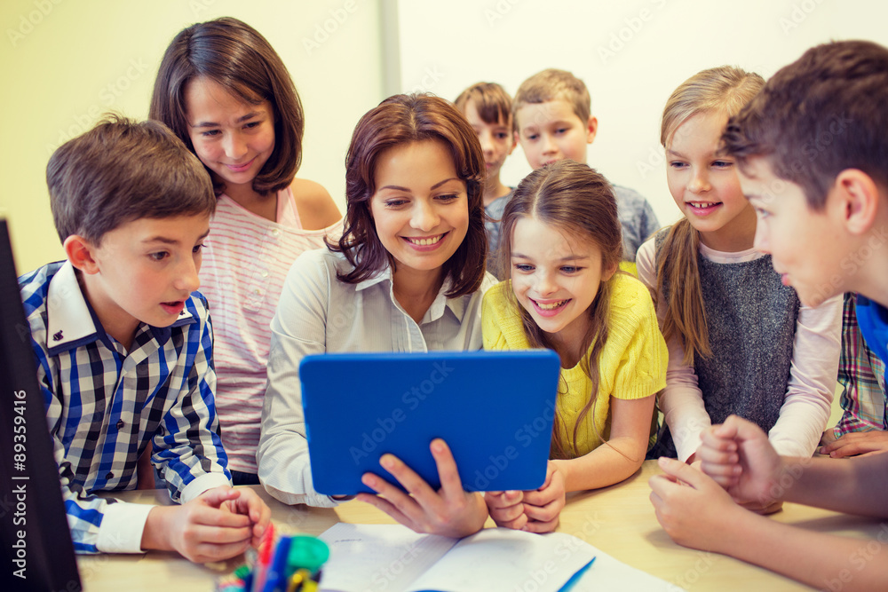 group of kids with teacher and tablet pc at school group of kids with teacher and tablet pc at school
