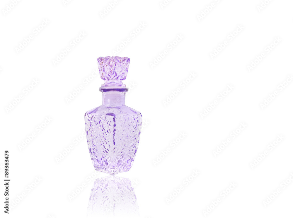 purple glass carafe isolated on white background with reflection