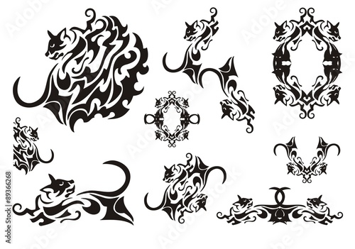 Tribal cat symbols. Butterfly wing in the form of a cat, a frame of a cat and cat's elements isolated on a white background