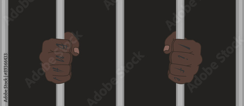 Black man fists holding prison bars