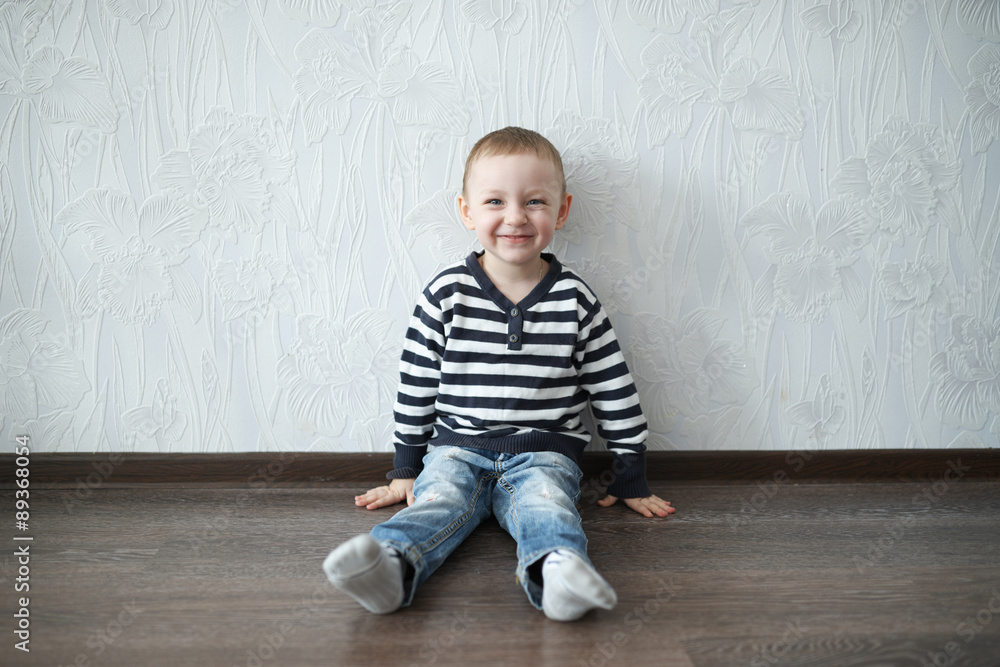 little boy sitting on the floor little boy sitting on the floor