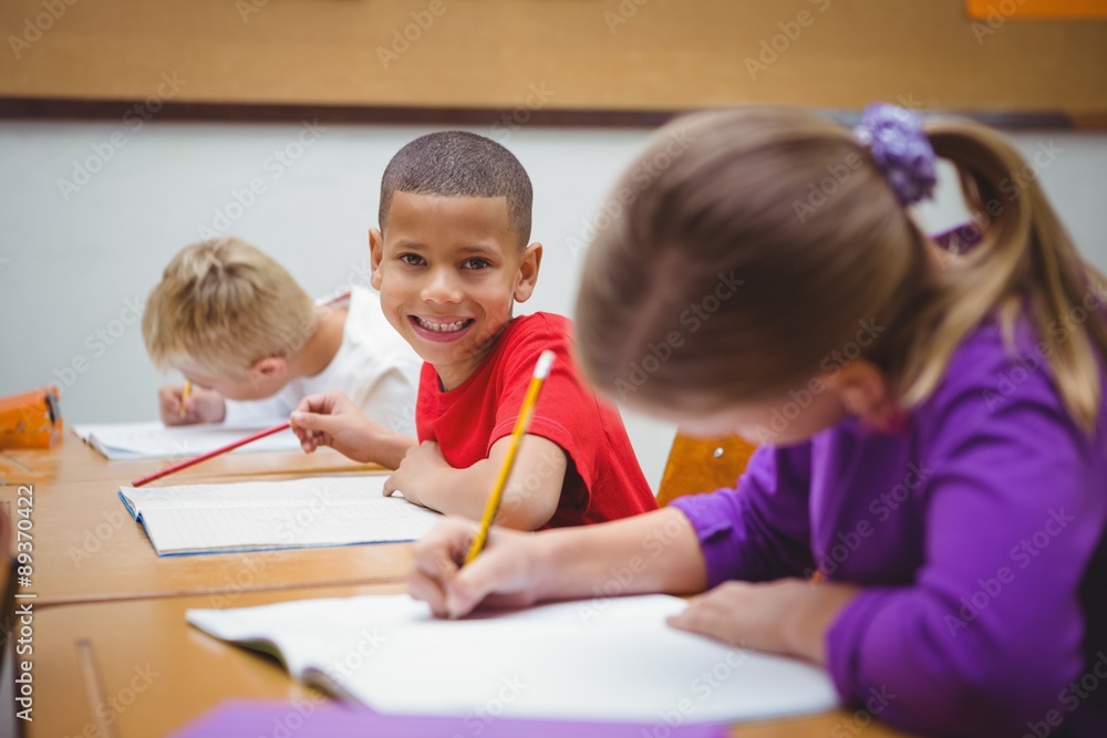 Students smiling and looking at the camera Students smiling and looking at the camera