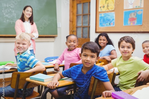 Students and teacher looking at the camera