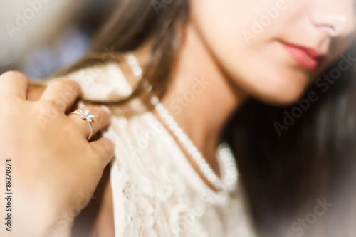 girl with ring and pearls in glamourous style